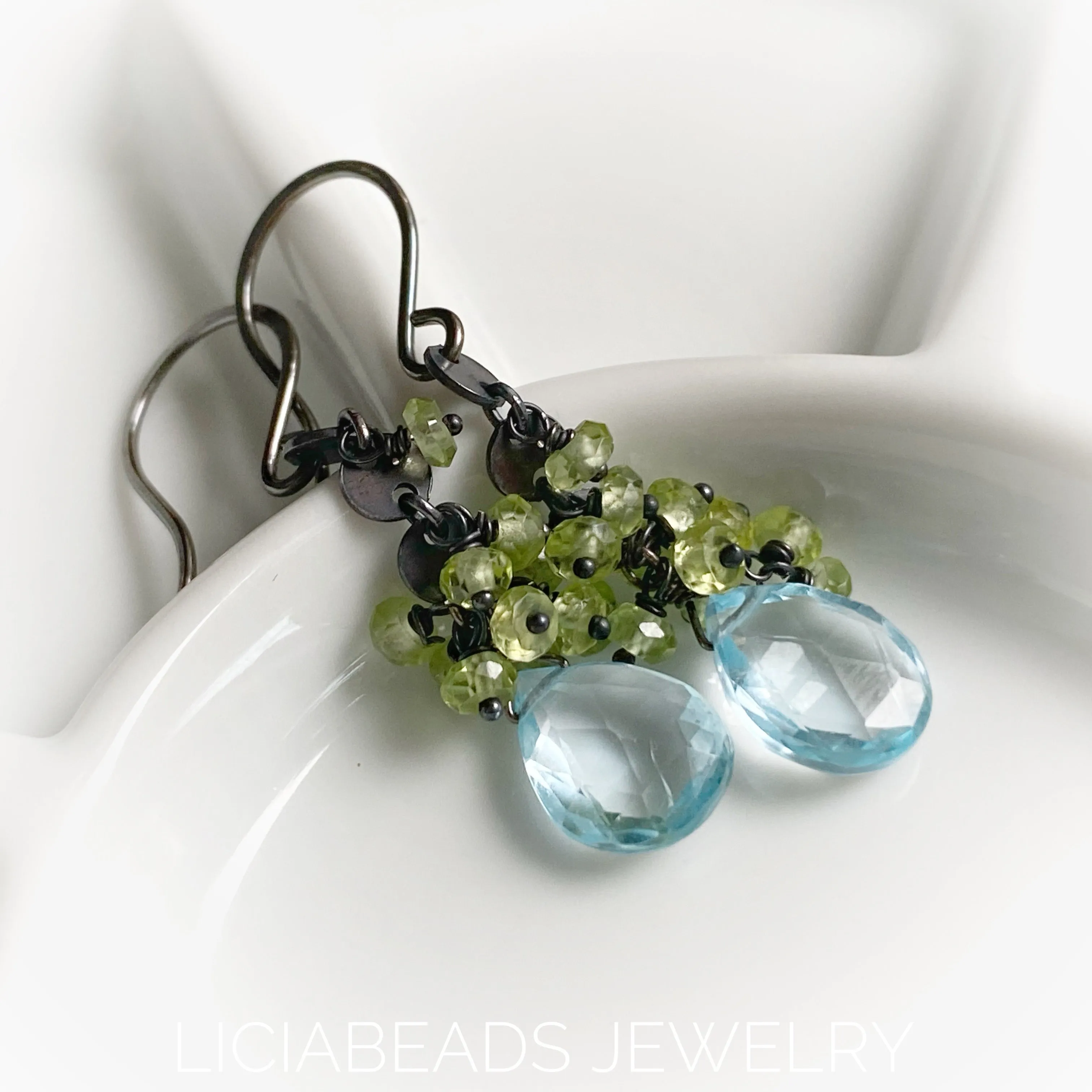 Blue Topaz and peridot gemstones on blackened sterling silver