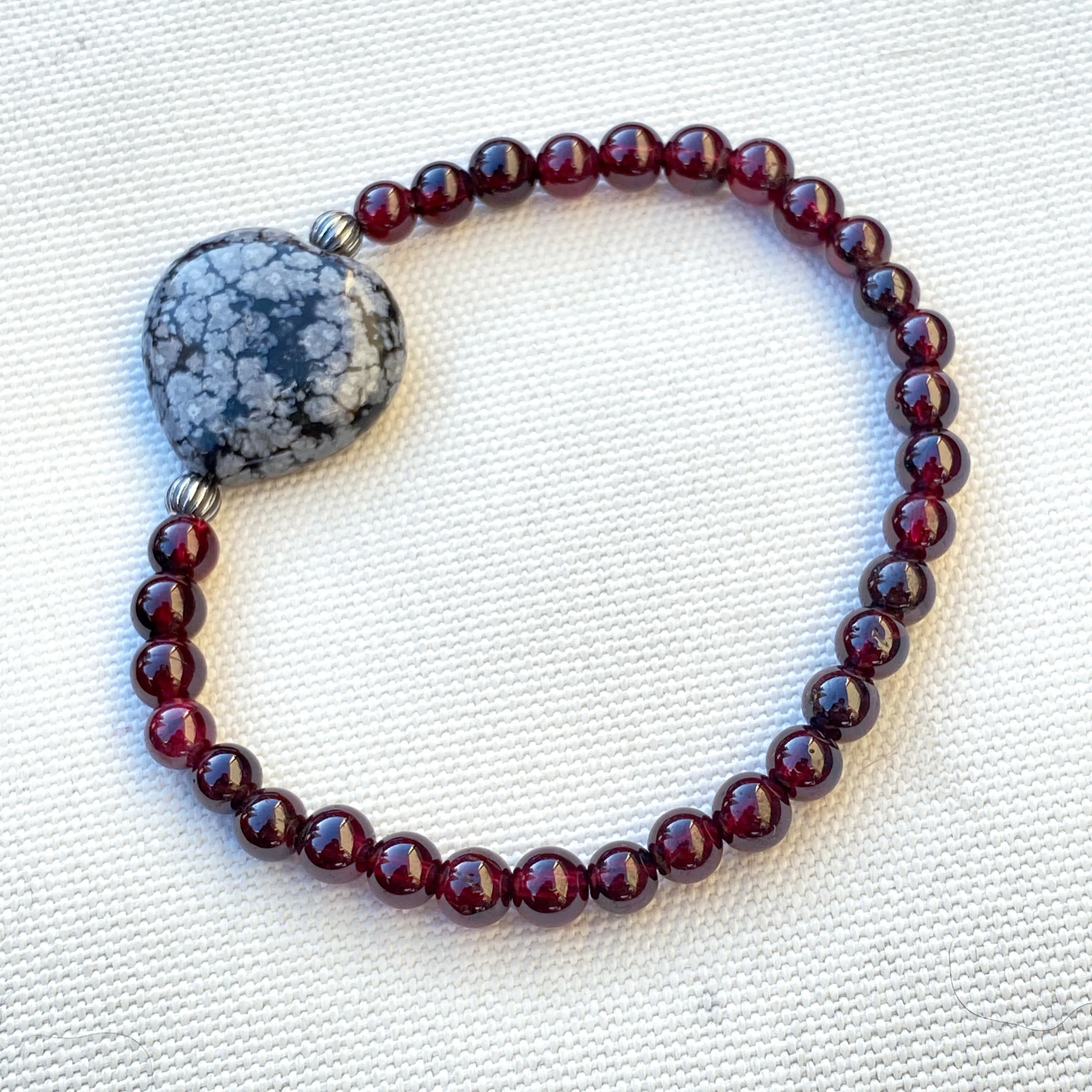 Garnet gemstones, Snowflake Obsidian Heart, and Sterling Silver Stretch Bracelet