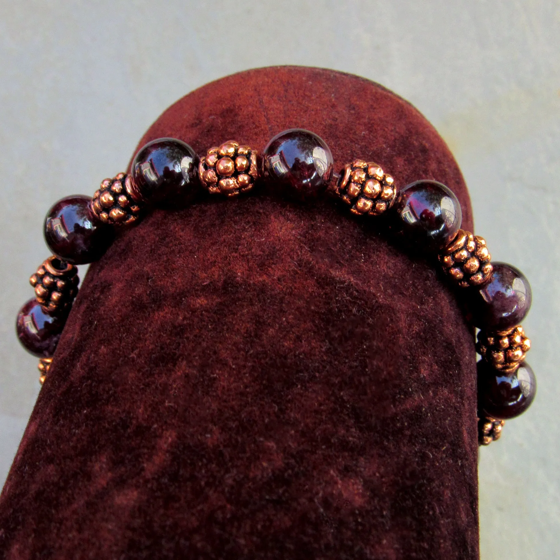 Garnet gemstones with copper stretch bracelet