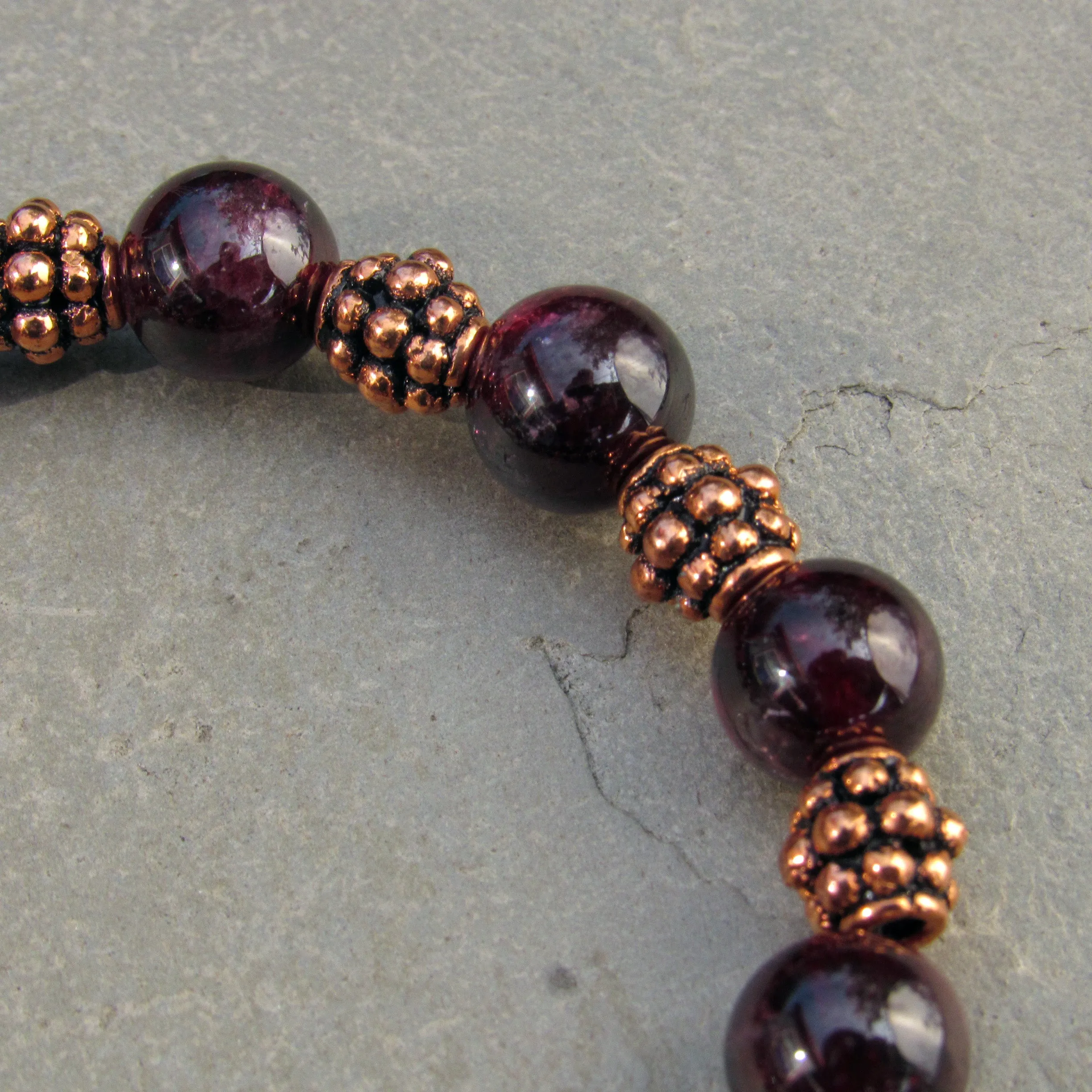 Garnet gemstones with copper stretch bracelet