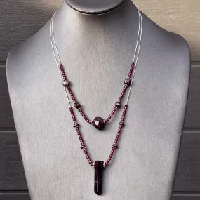 Garnet gemstones with sterling silver double strand necklace.