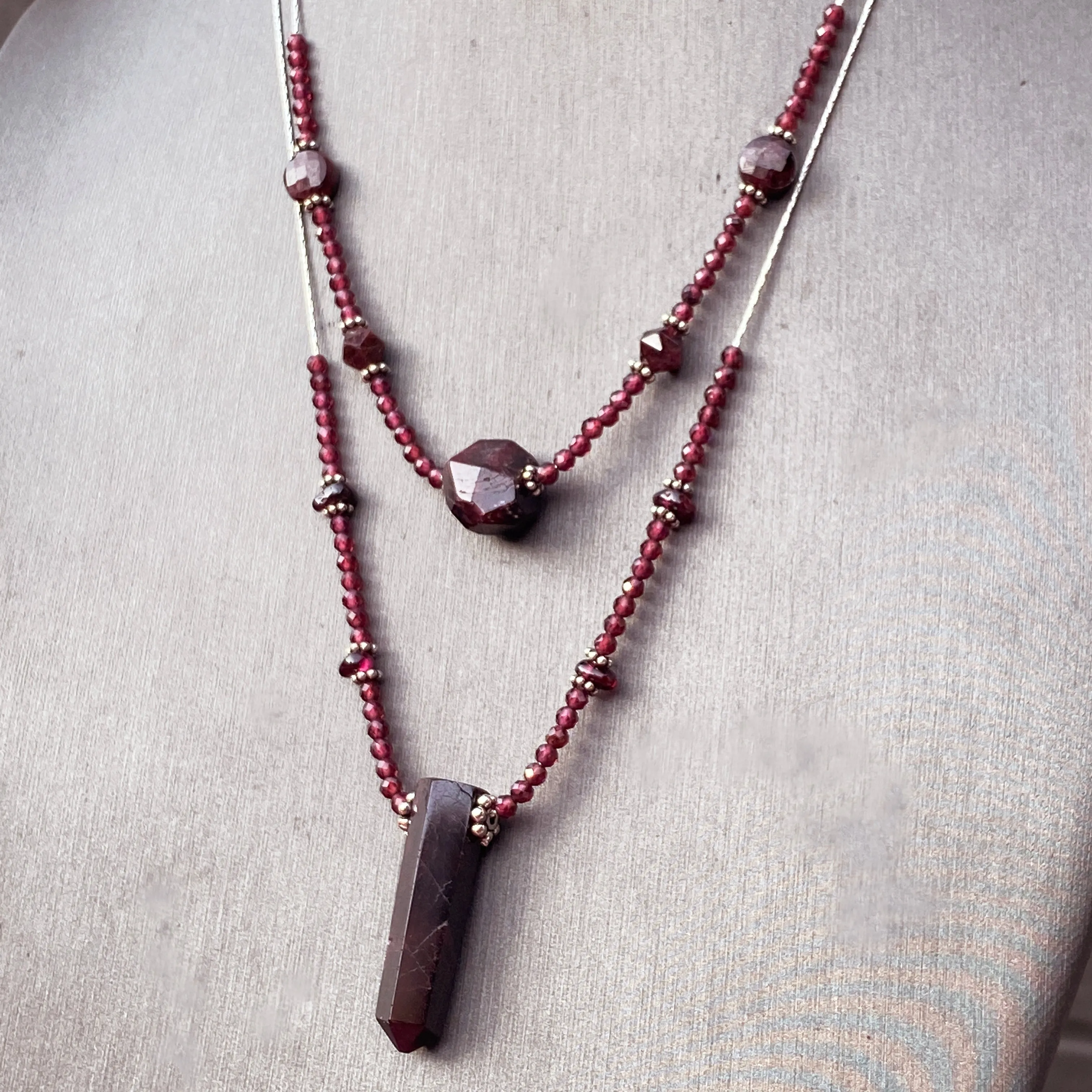 Garnet gemstones with sterling silver double strand necklace.